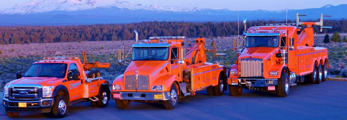 3 tow trucks from Consolidated Towing in Bend, Oregon